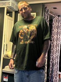 Load image into Gallery viewer, Customer wearing the Face Your Fear mountain lion tee in forest green